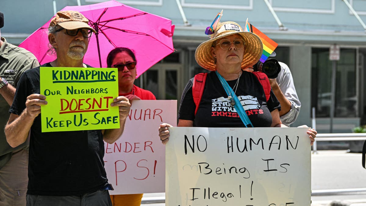 Demonstrators rally outside Miami Federal Court calling for Governor Ron DeSantis to abide by the court's restraining order blocking enforcement of a new immigration law, in Miami on May 29, 2025. Federal Judge Kathleen Williams issued a temporary injunction against the immigrant law which according to opponents created new state crimes targeting immigrants entering and living in Florida. (Photo by CHANDAN KHANNA / AFP) (Photo by CHANDAN KHANNA/AFP via Getty Images)