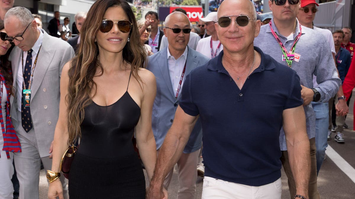 Jeff Bezos and Lauren Sanchez walking manus successful manus successful Monaco