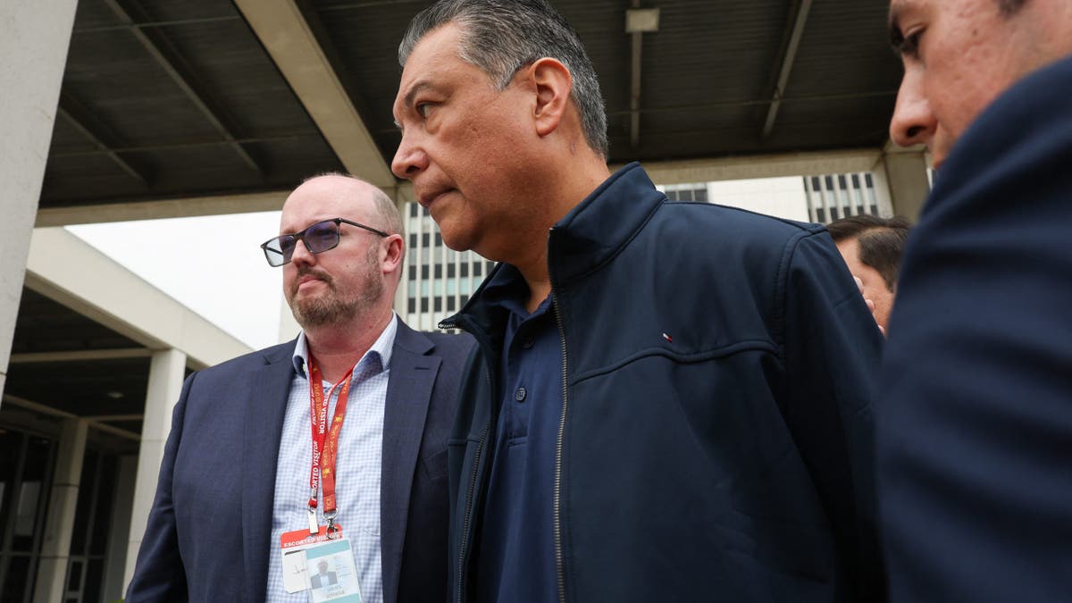 Alex Padilla with others outside building