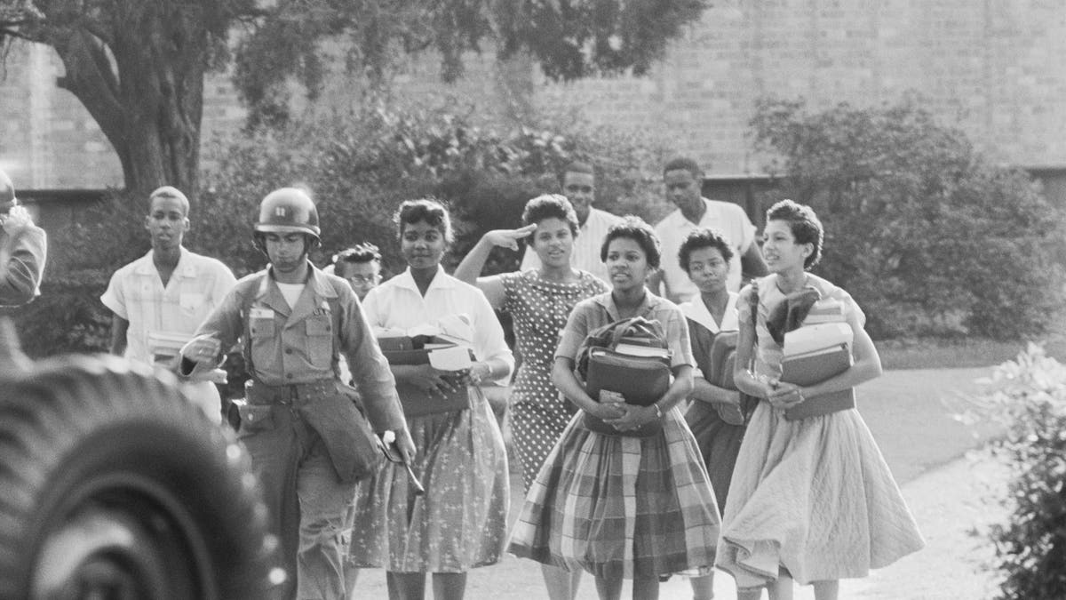 Historic photo shows nine black students leaving a school in Little Rock, Arkansas after integration