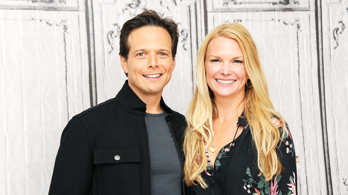 kelley and scott wolf smiling in 2016