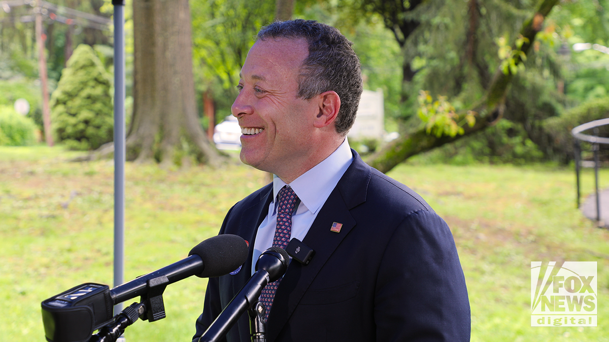 Representative Josh Gottheimer smiles while voting at the Presbyterian Church in Tenafly New Jersey