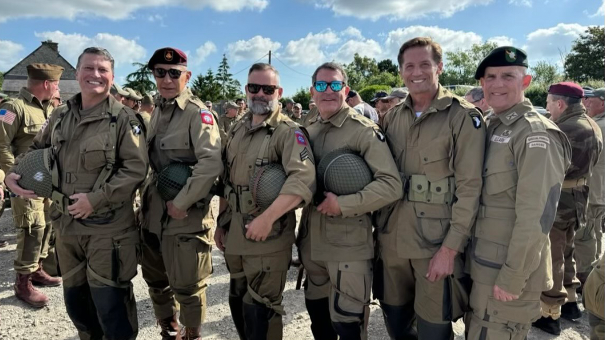 Rep. Mark Green, R-Tenn., and other members of Congress reenacting the historic WWII jump over Normandy in 2024.