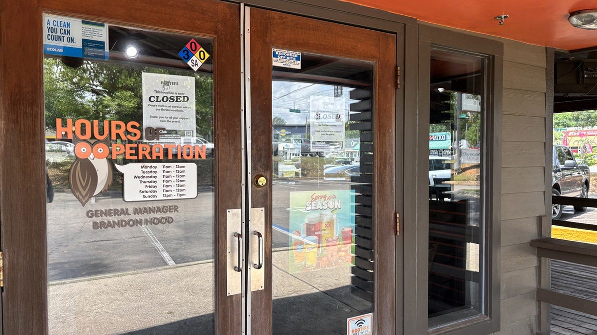 A sign outside the Hooters location in Tallahassee, Florida, states that the restaurant is closed.