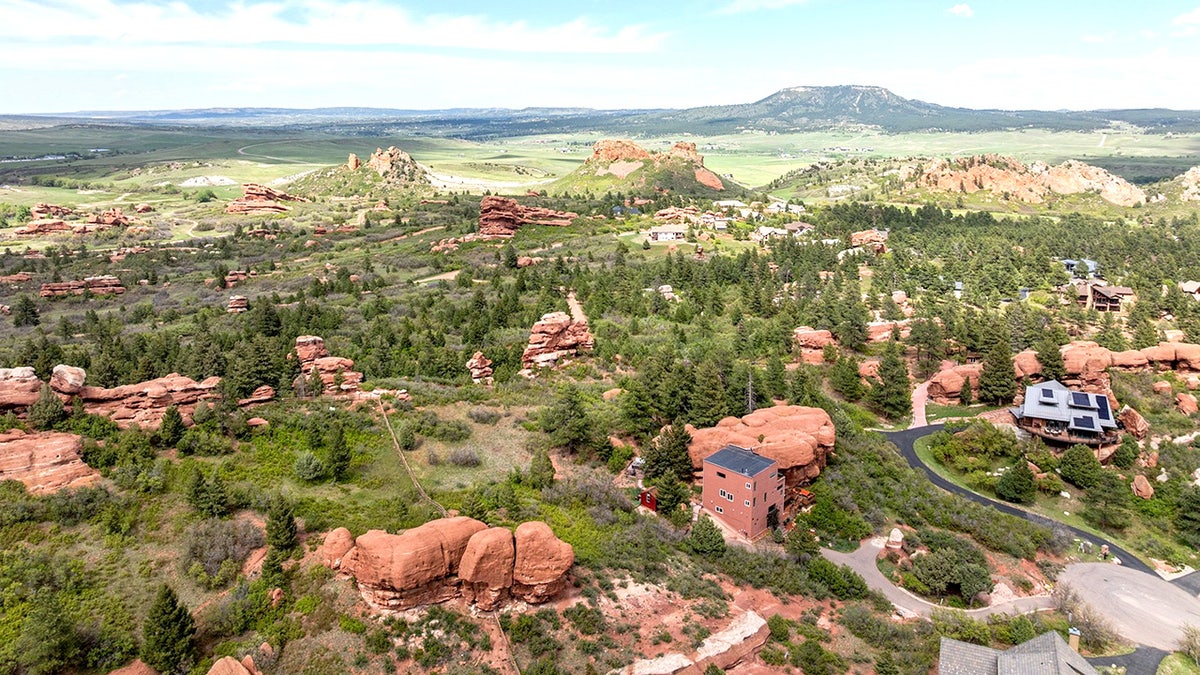 Check out this real-life Flintstones home built around a 200 million-year-old red rock. The two-bedroom house in Larkspur, Colorado, US, has a very unique style - perfect for a Flintstone fan. The property - nicknamed the rock house - is integrated with nature, nestled around a 45ft high section of one of Colorado's beloved 200-million-year-old red rocks. On the market for $1m, the property "transforms nature's artistry into a one-of-a-kind architectural statement". The property boasts walking trails, a picnic area, Milky Way views from the private hot tub, and all the peace and serenity a homeowner could wish for.