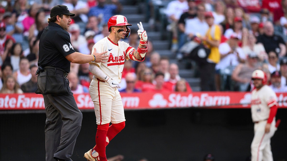 Zach Neto has gestures to Hunter Brown