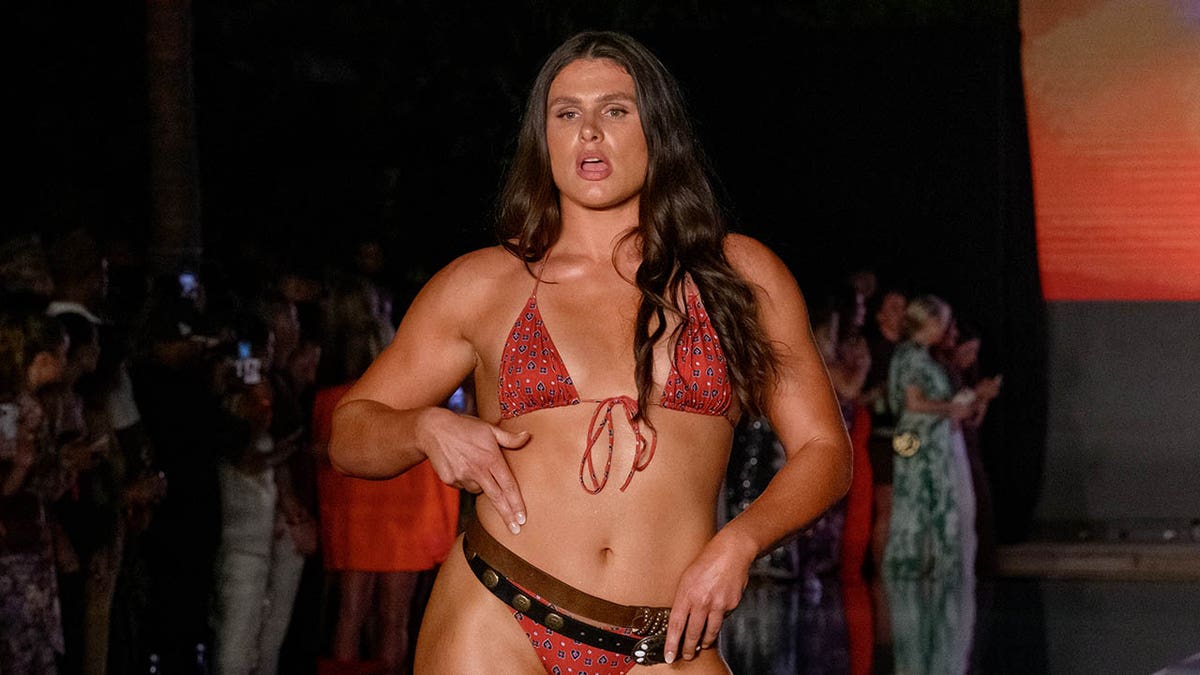 Ilona Maher walks down the runway