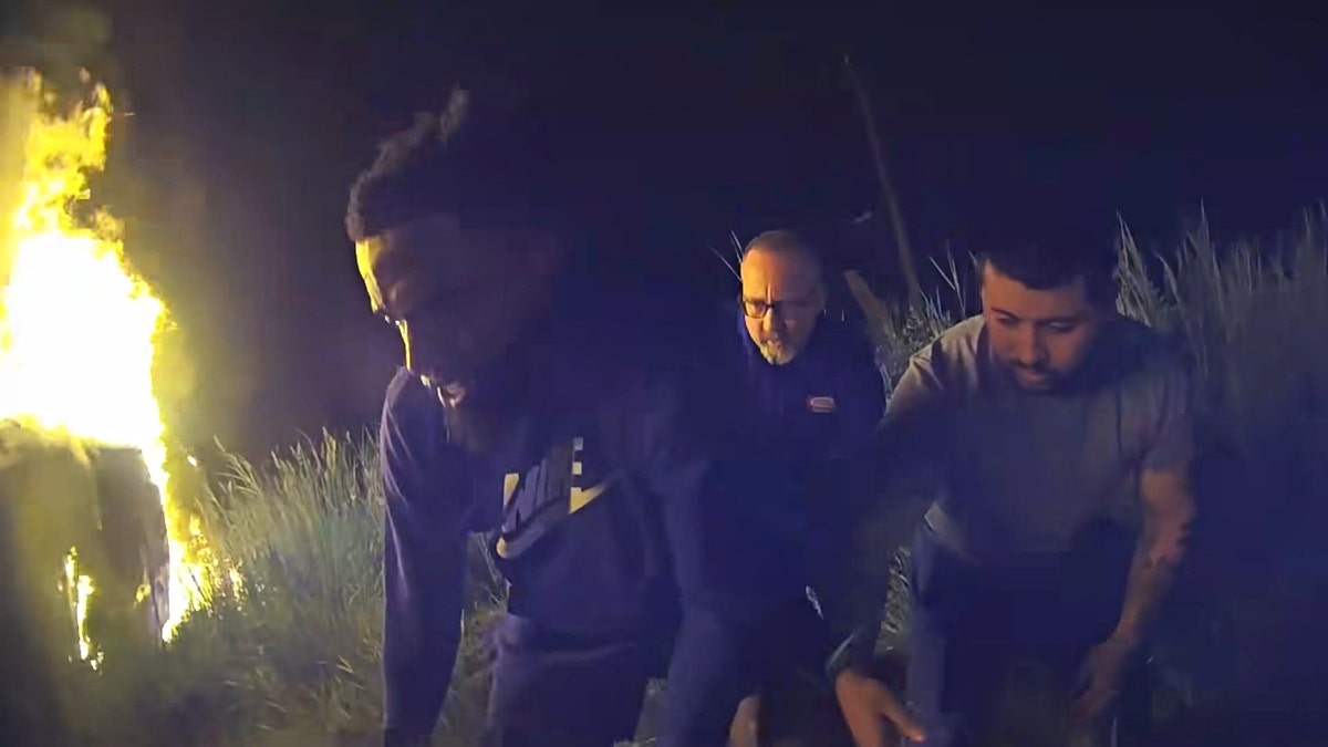 Screenshot of crash footage showing a good Samaritan