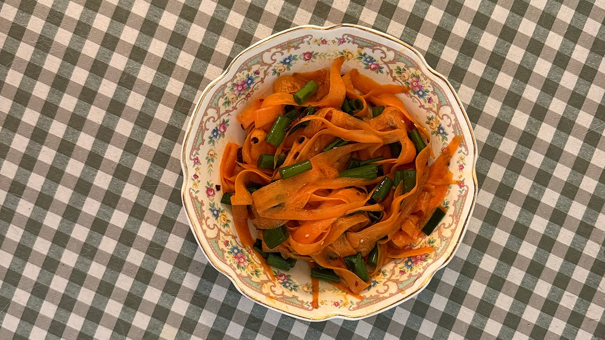 A vessel  of carrot ribbon salad