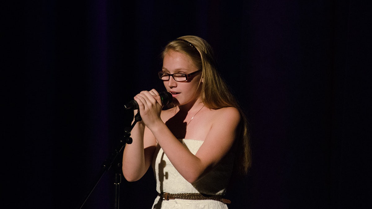 Emily Ferlazzo singing.