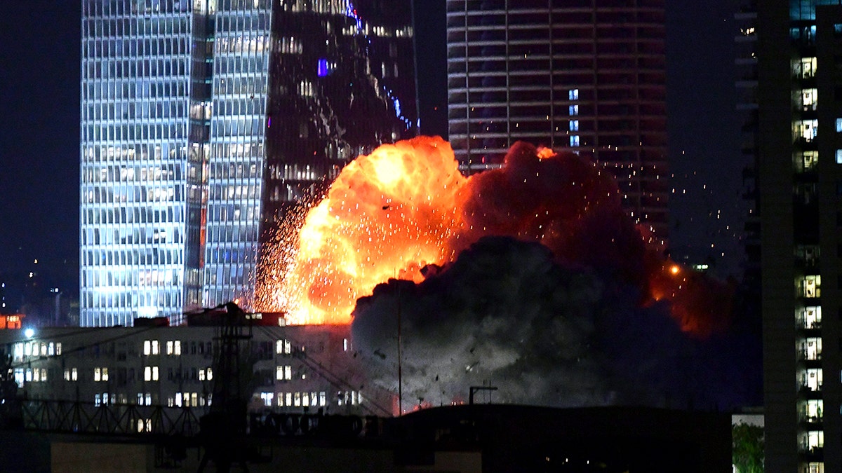 Flames erupt after an Iranian missile strike on Tel Aviv