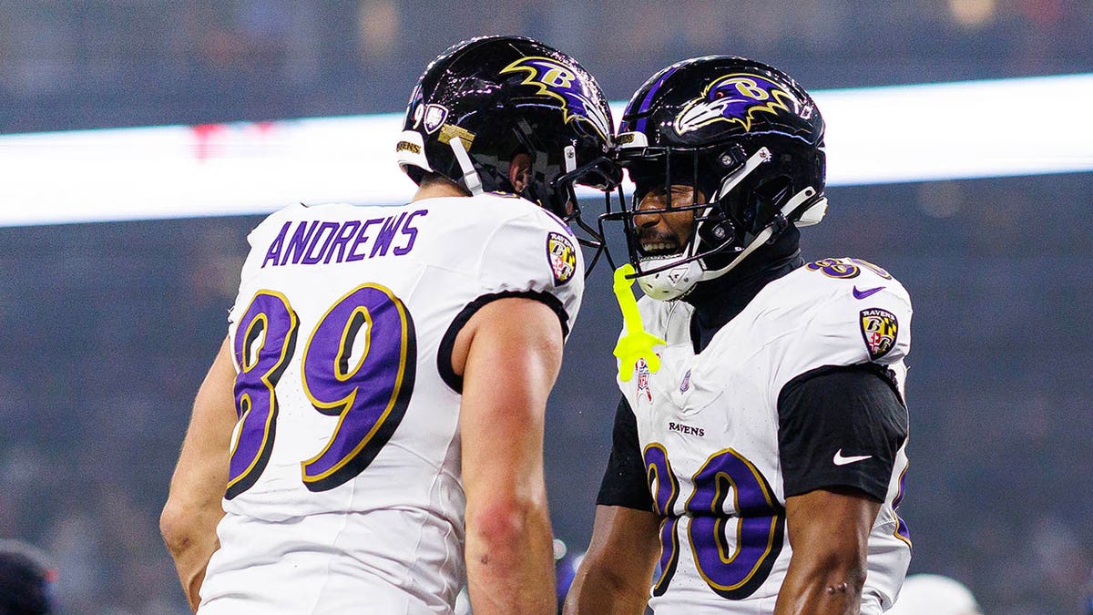 Isaiah Likely and Mark Andrews celebrate