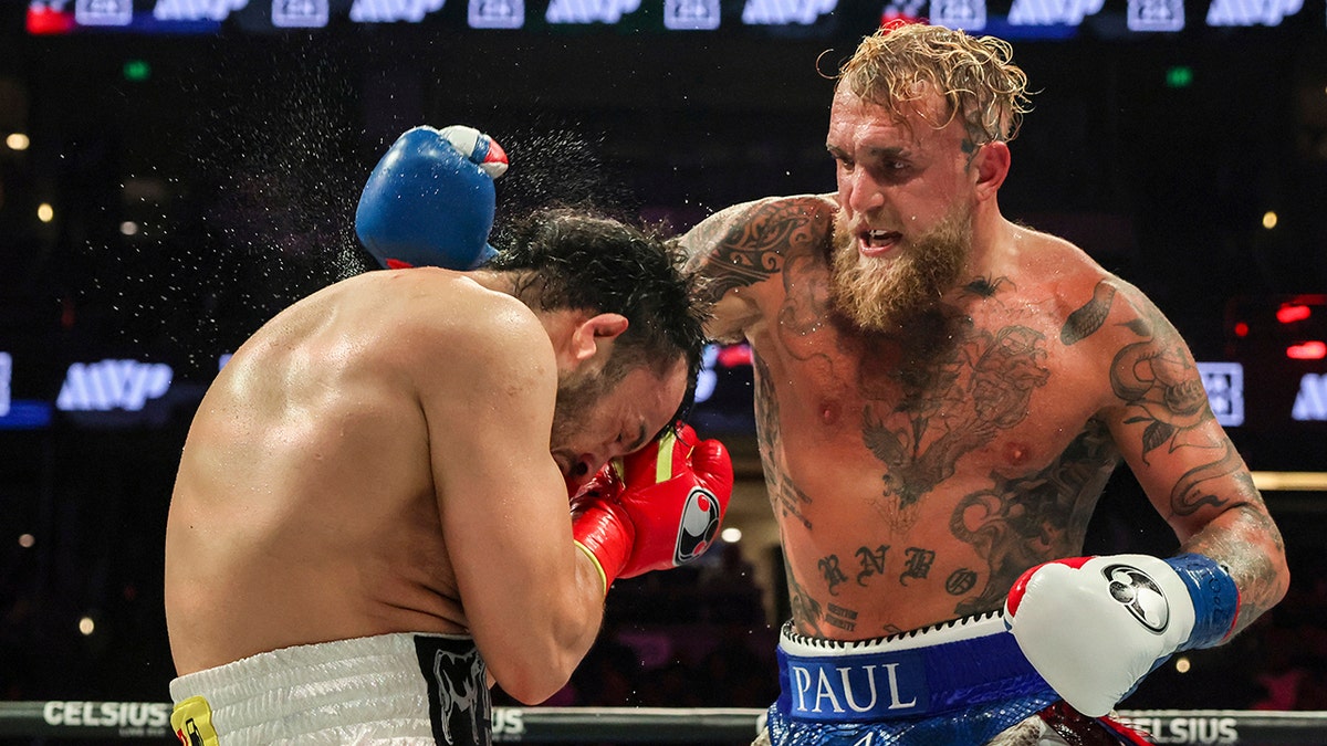 Jake Paul throws a punch