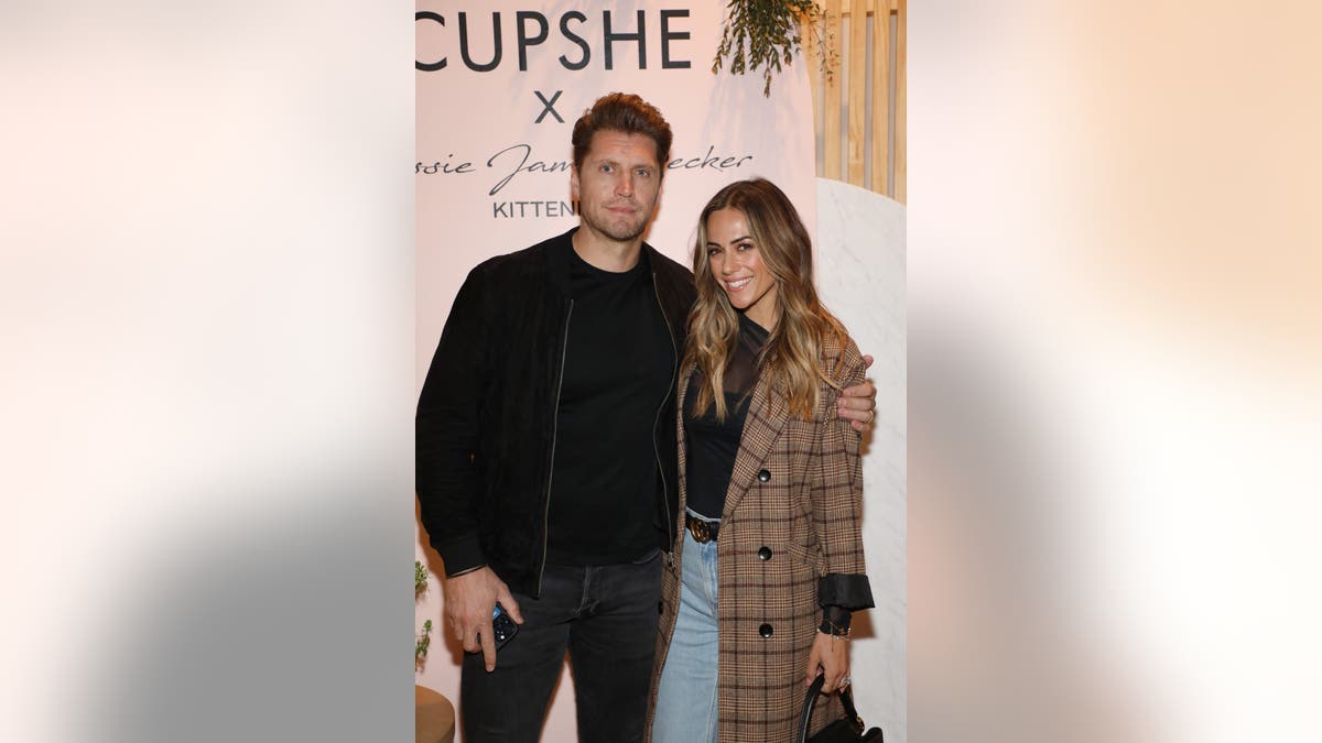 Jana Kramer embracing husband Allan Russell