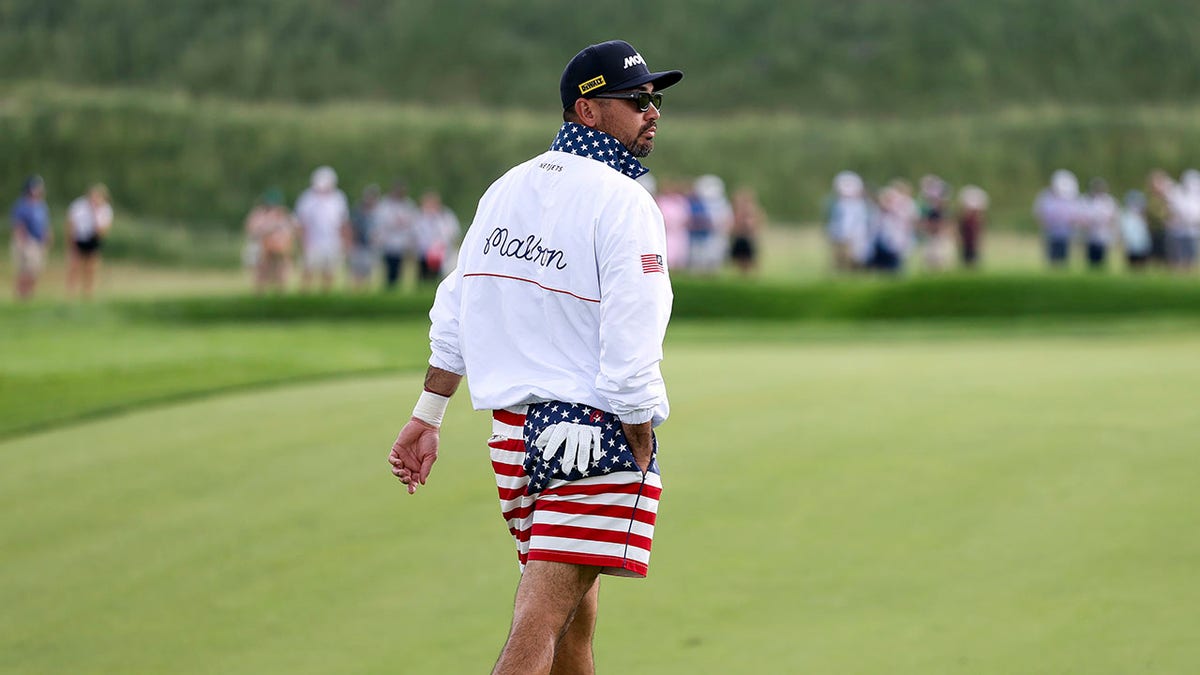 Jason Day walks on course