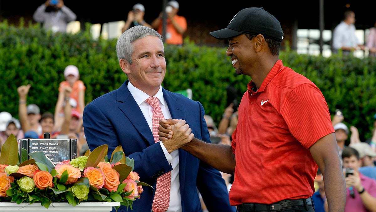 Jay Monahan and Tiger Woods