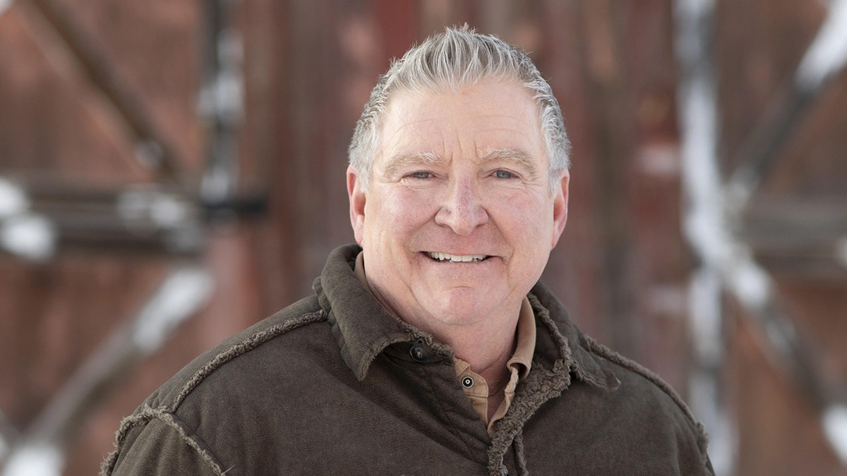 Jim Daly, president of Focus on the Family, smiling outdoors in a brown jacket