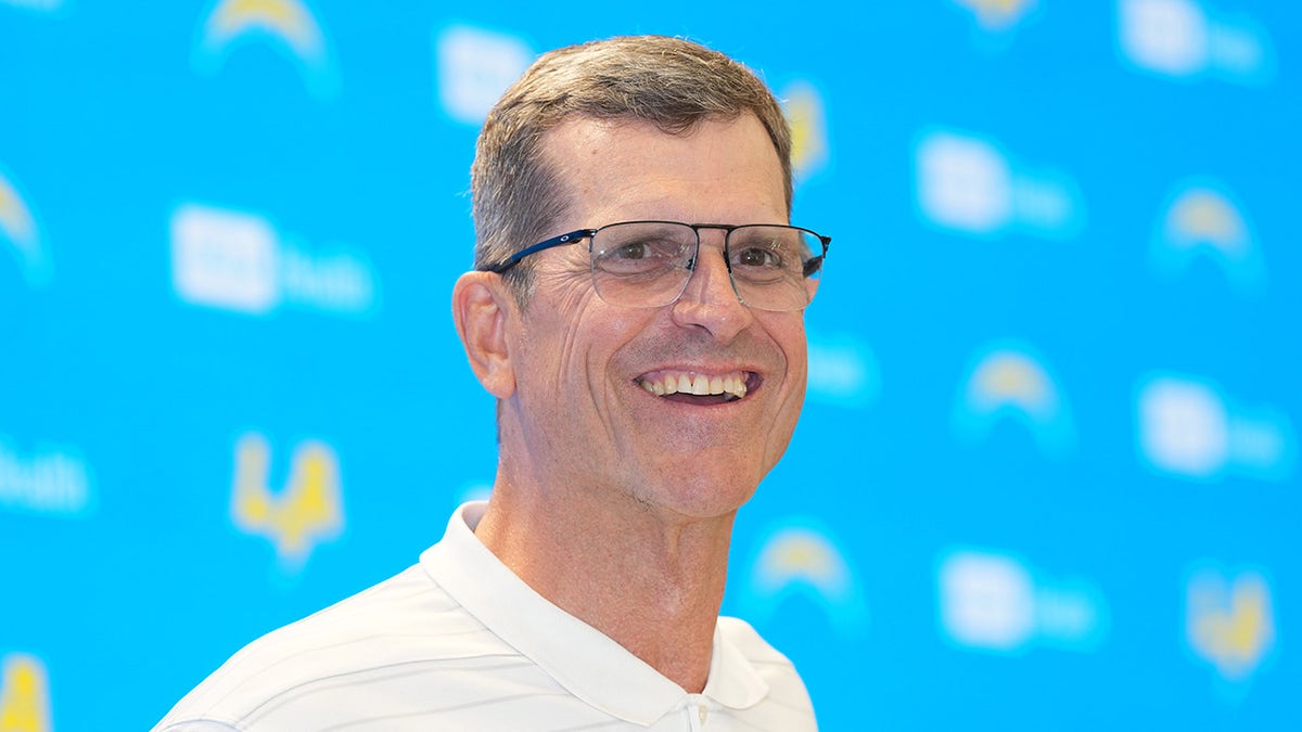 Jim Harbaugh smiles