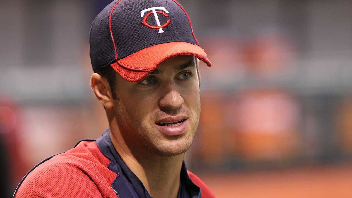Joe Mauer looks on