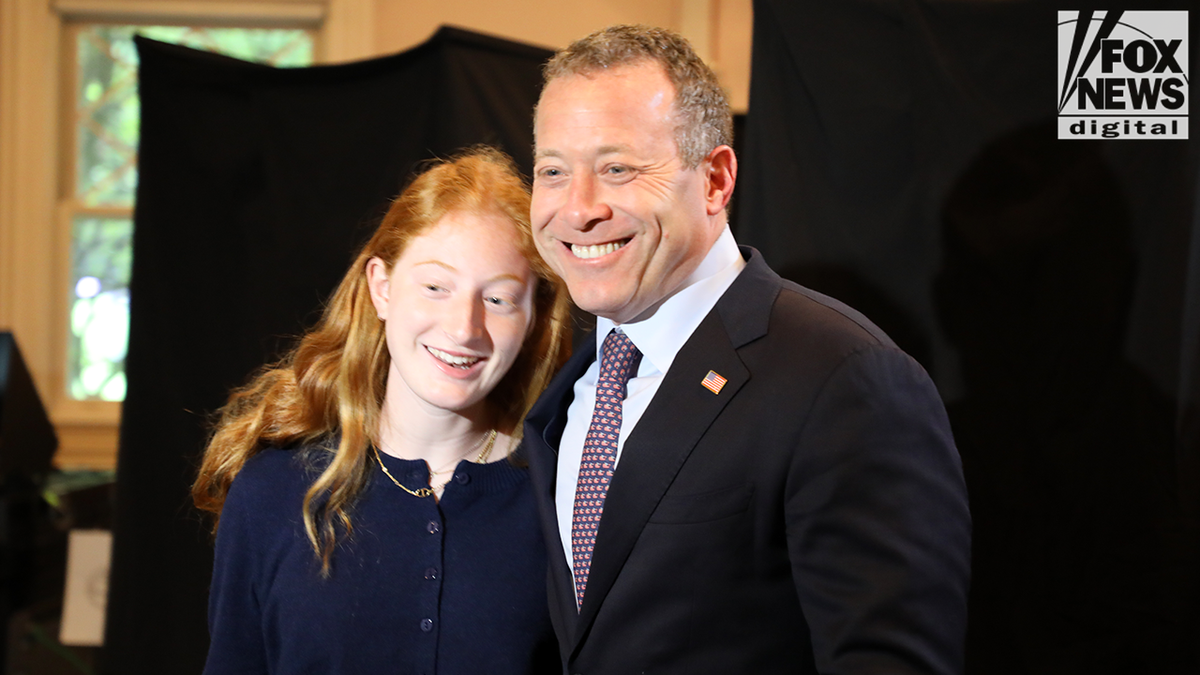Rep. Josh Gottheimer smiles for a photo with his daughter after filling out his ballot.