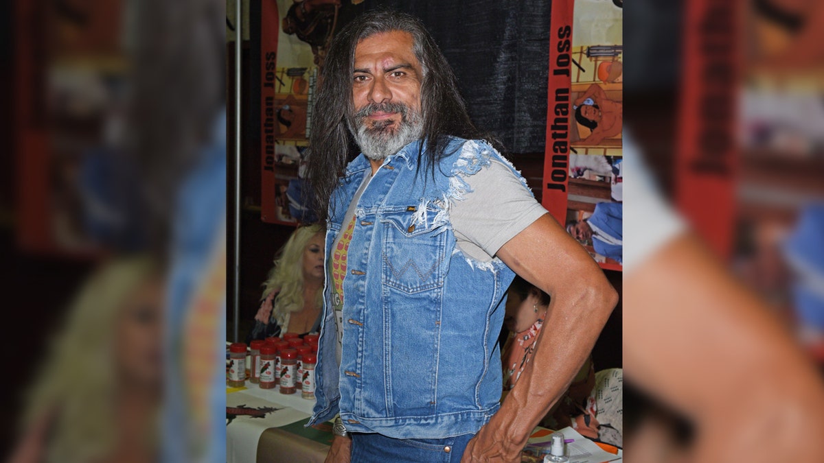 King of the Hill actor Jonathan Joss wears denim vest.