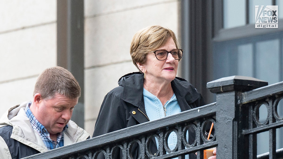 John O'Keefe's mother Peggy outside the court.