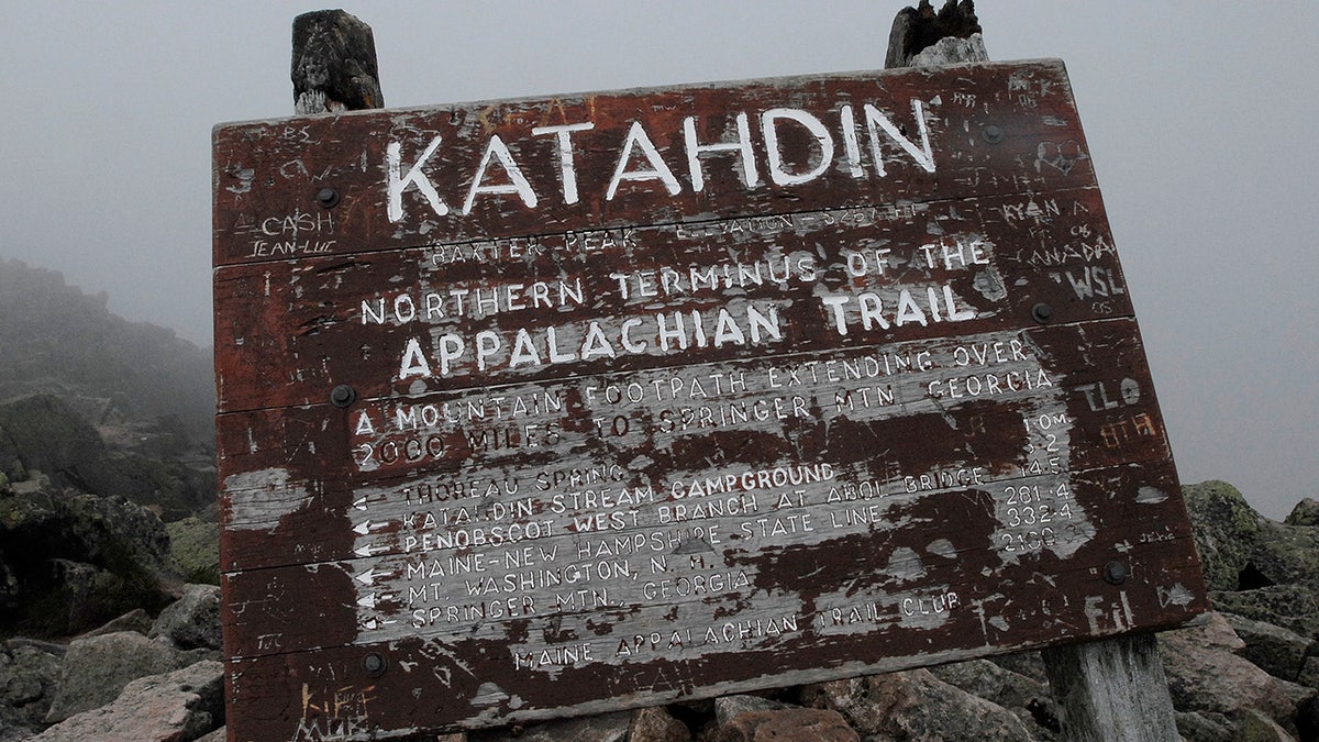 weathered sign at Baxter Peak