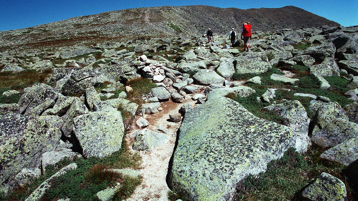 Hikers marque their mode crossed Mount Katahdin's tableland