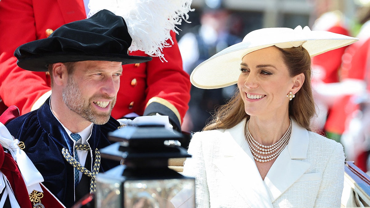 Prince William and Kate Middleton smiling astatine each different successful royal ceremonial deterioration sitting connected a carriage.