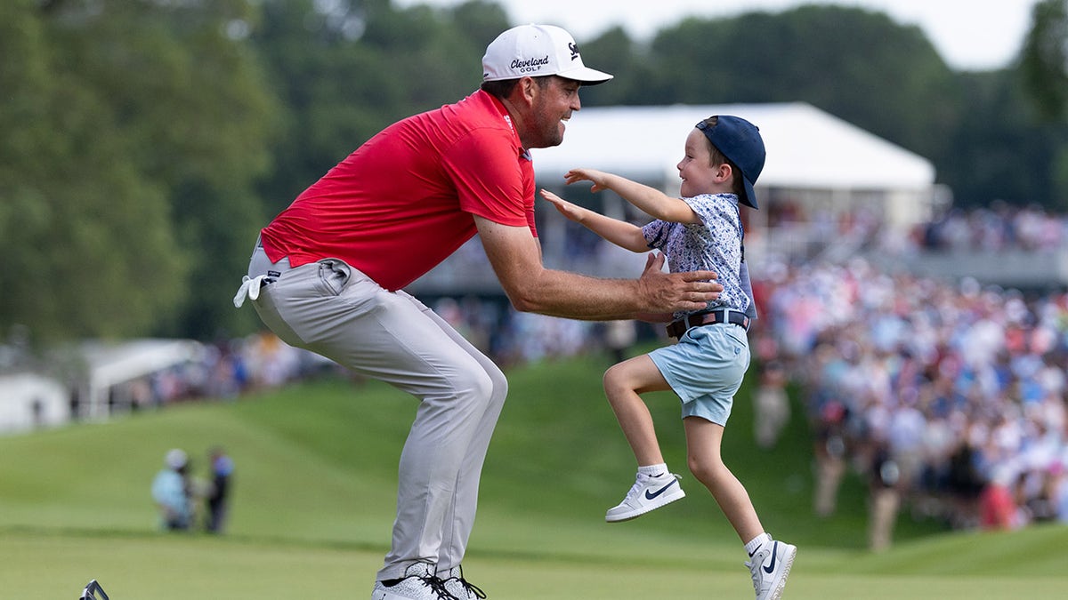 Keegan Bradley celebrates triumph with son