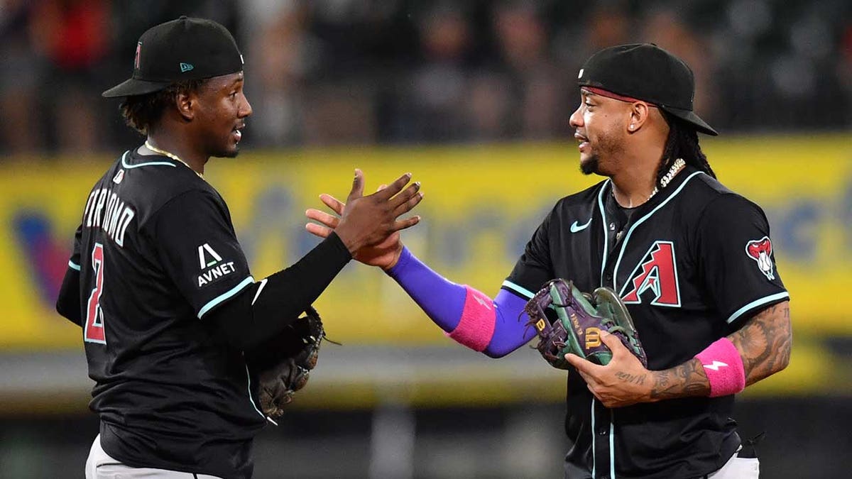Geraldo Perdomo and Ketel Marte celebrate