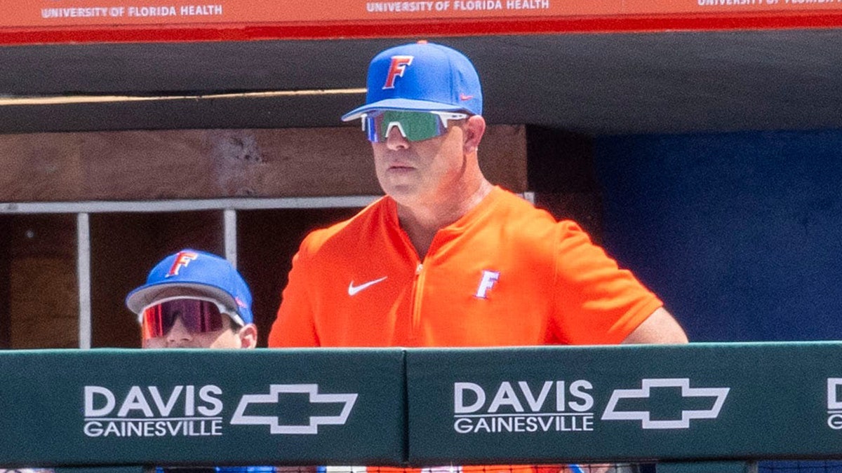 Kevin O'Sullivan looks out on field from dugout