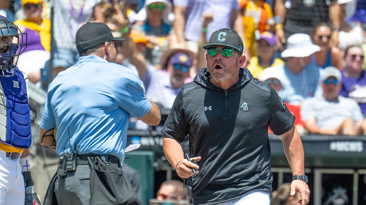Kevin Schanll rushes the umpire