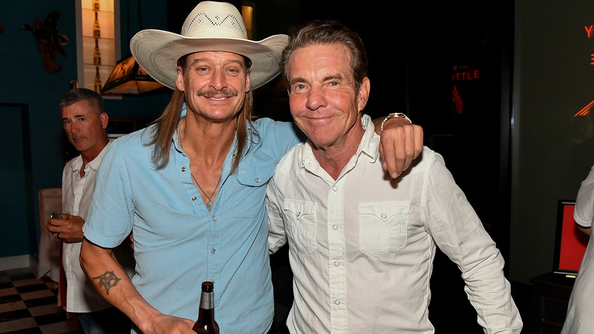 Kid Rock and Dennis Quaid, left to right, pose for a photograph at the grand opening event for Kid Rock's The Detroit Cowboy restaurant.