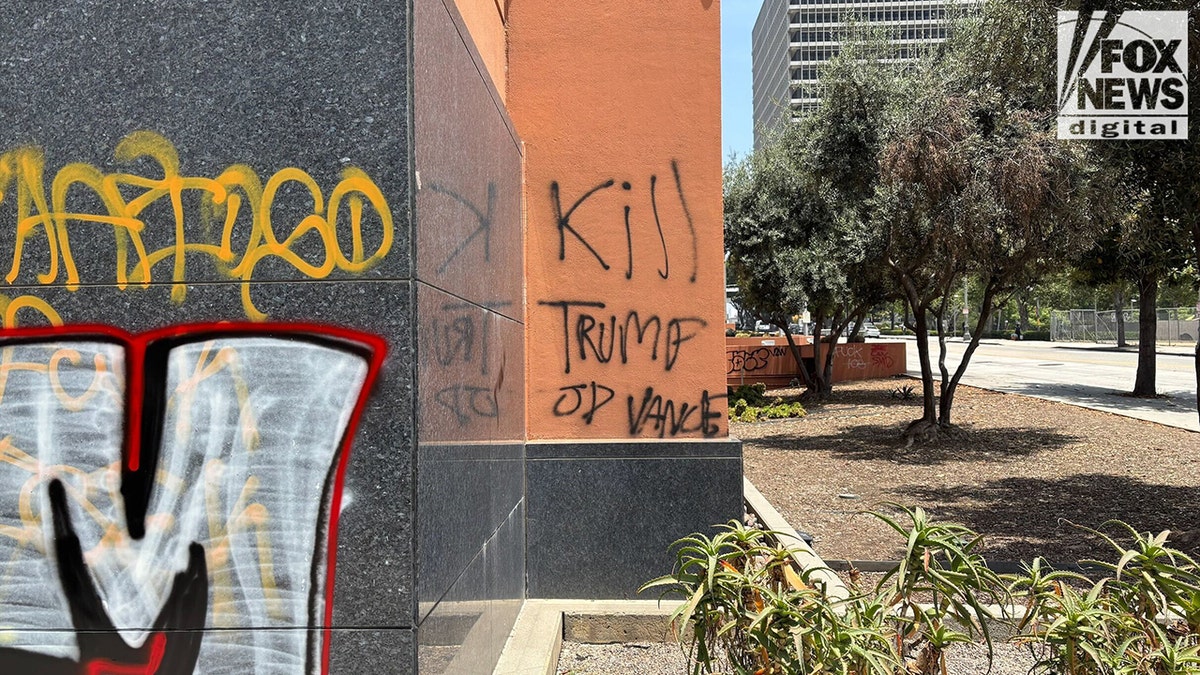 'Kill Trump' graffitied connected burnt orangish partition successful downtown Los Angeles