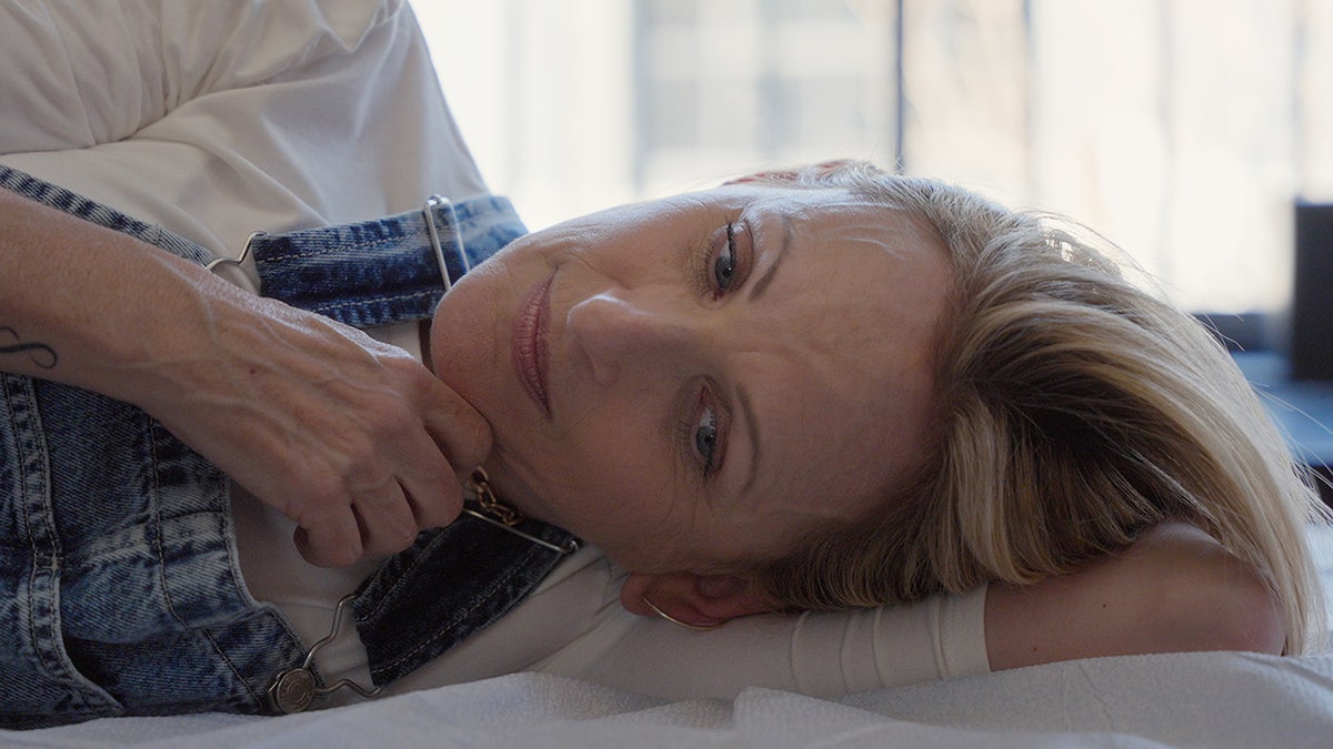 Marlee Matlin laying in bed.