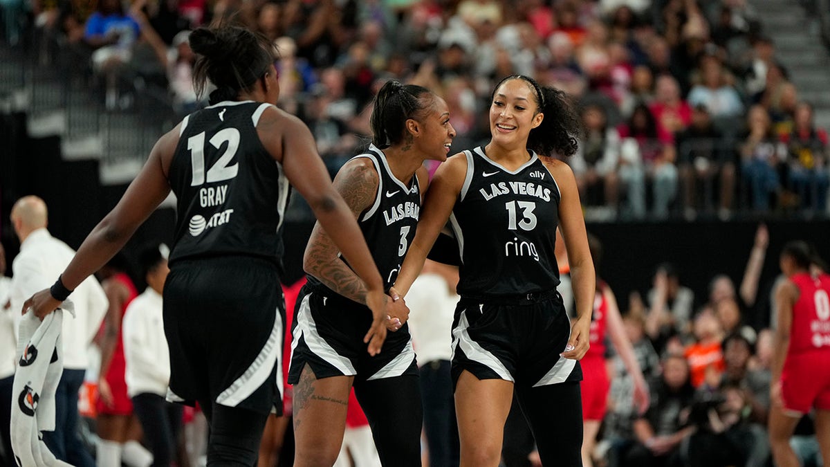 Las Vegas Aces players reacts connected  court