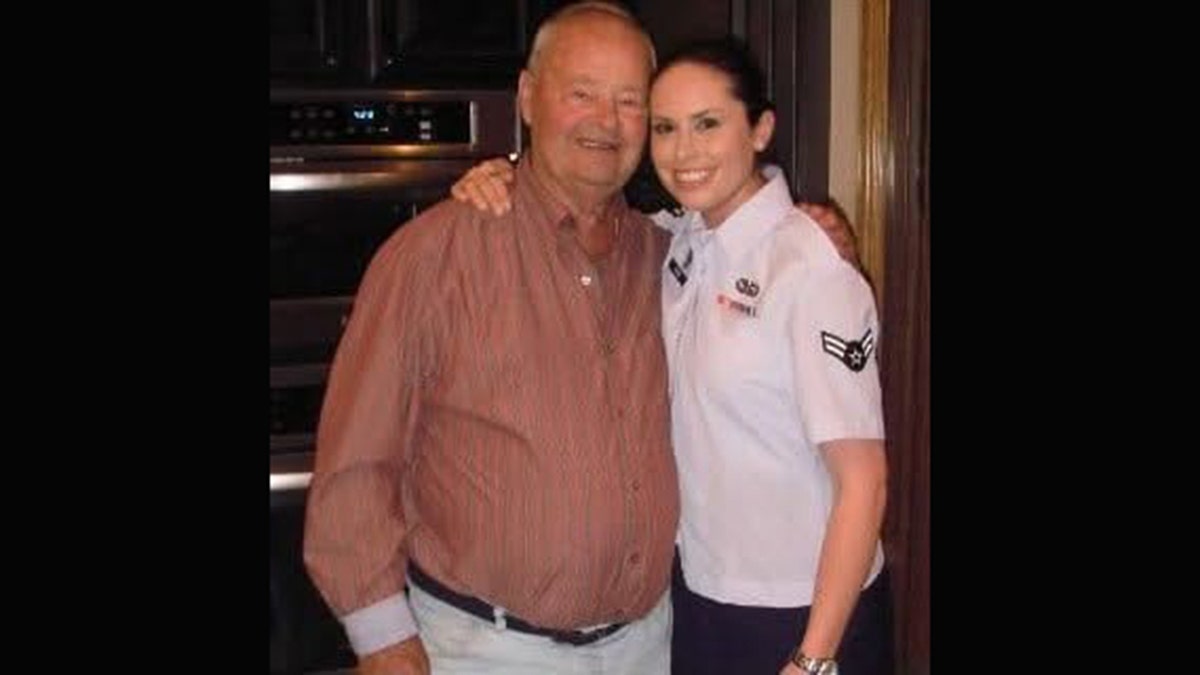 Lindsay Gutierrez being embraced by her grandfather.