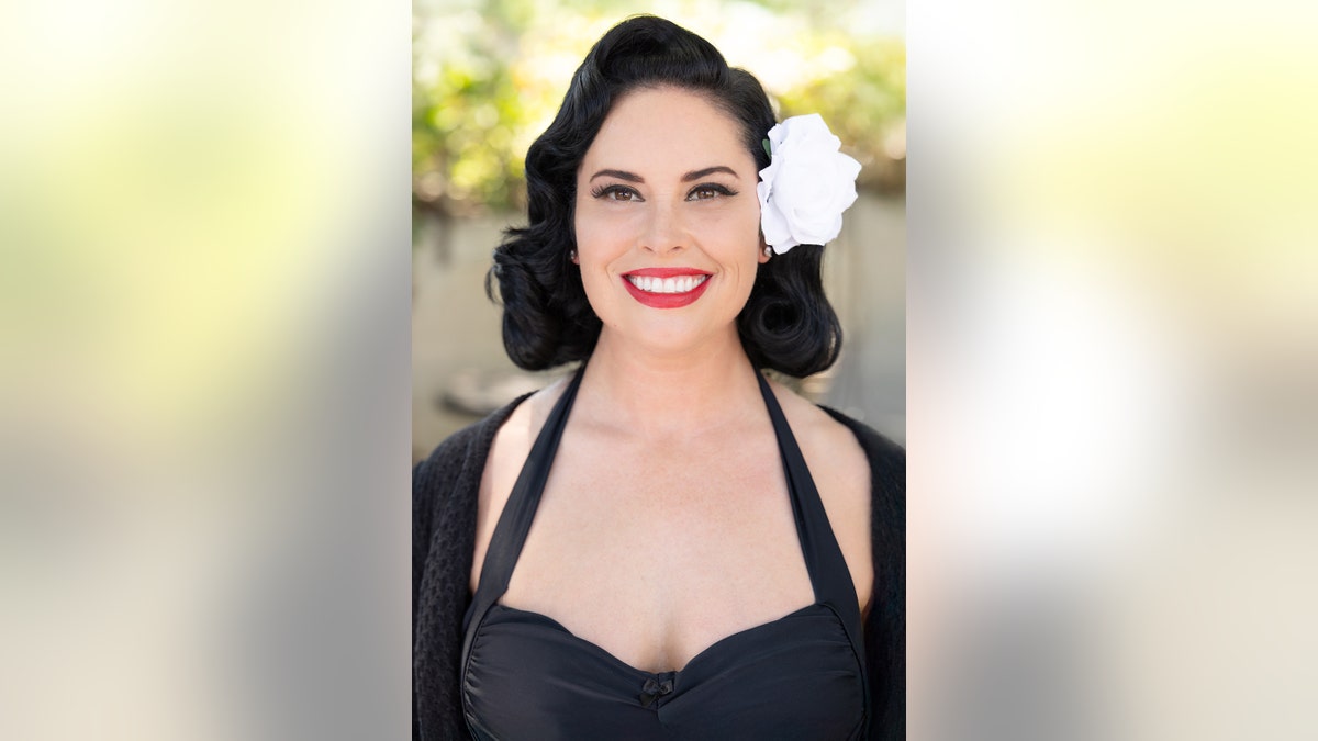 A close-up of Lindsay Gutierrez as a '40s pinup