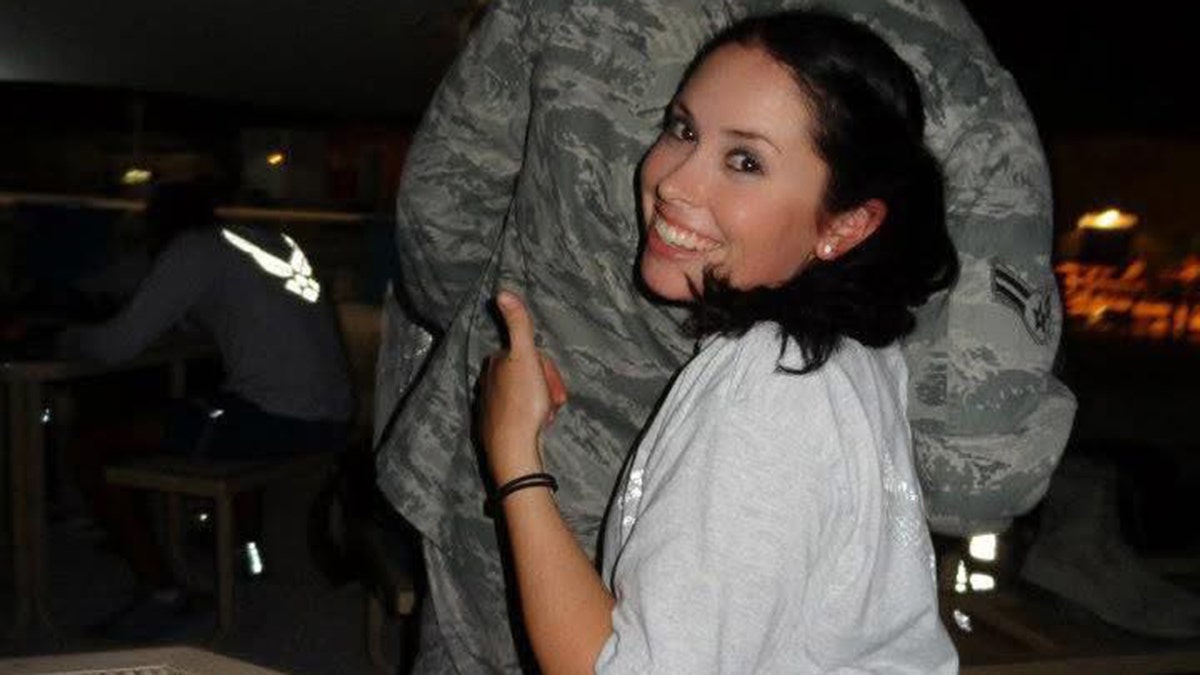 Lindsay Gutierrez wearing a white shirt and giving a thumbs up.