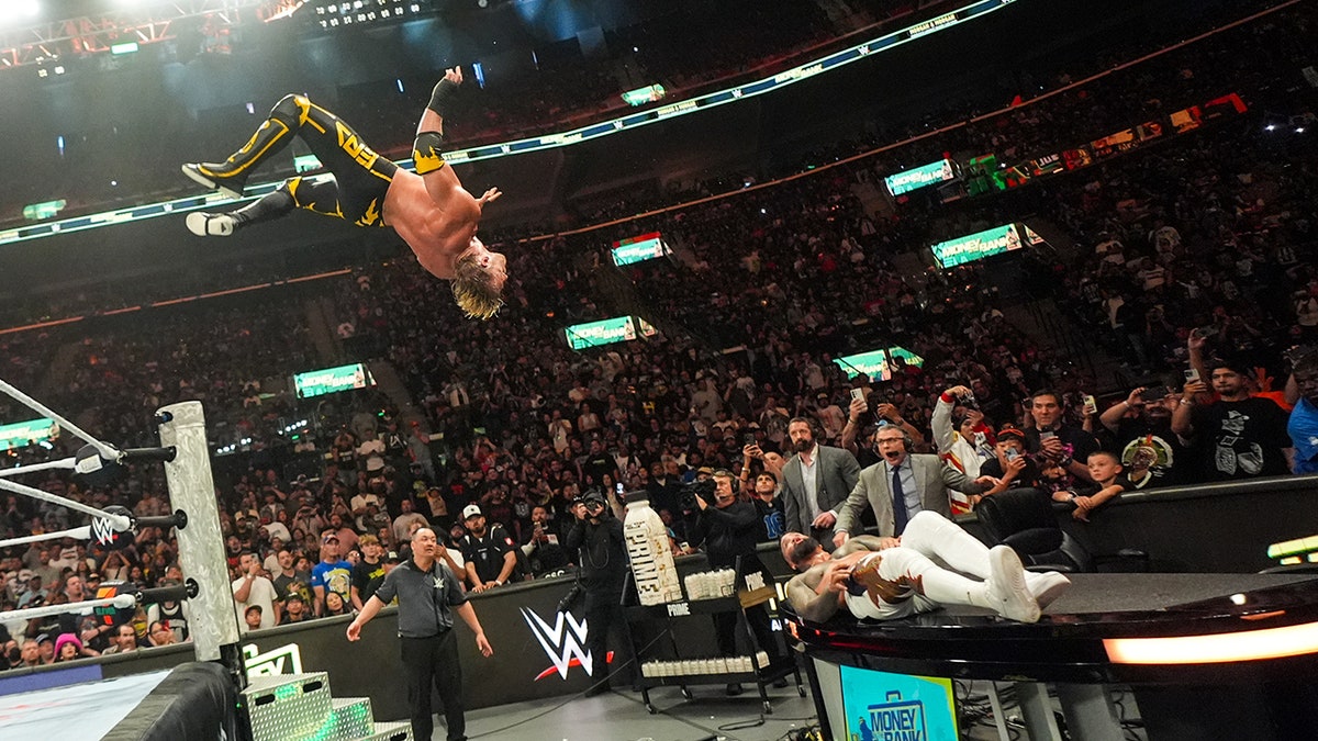 Logan Paul flips onto Jey Uso