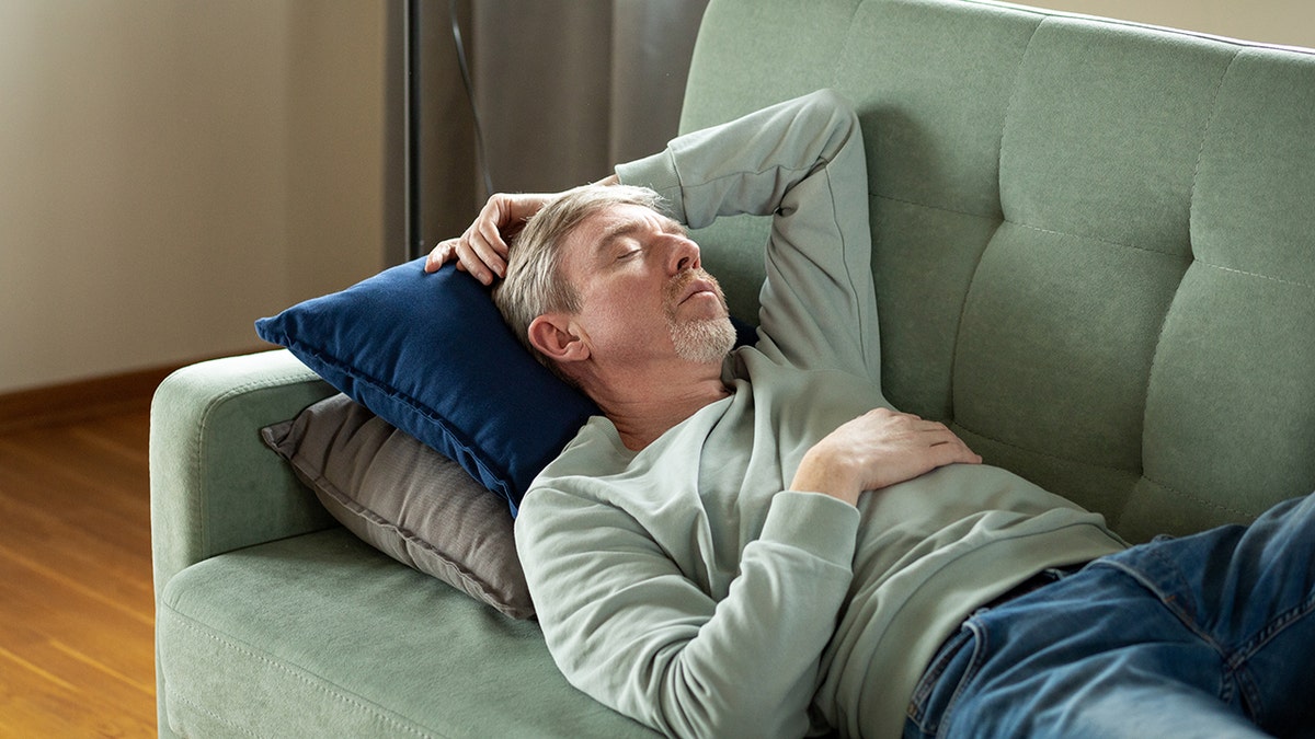 Study links frequent daytime napping to higher mortality in older adults 2 Sleeping man on couch