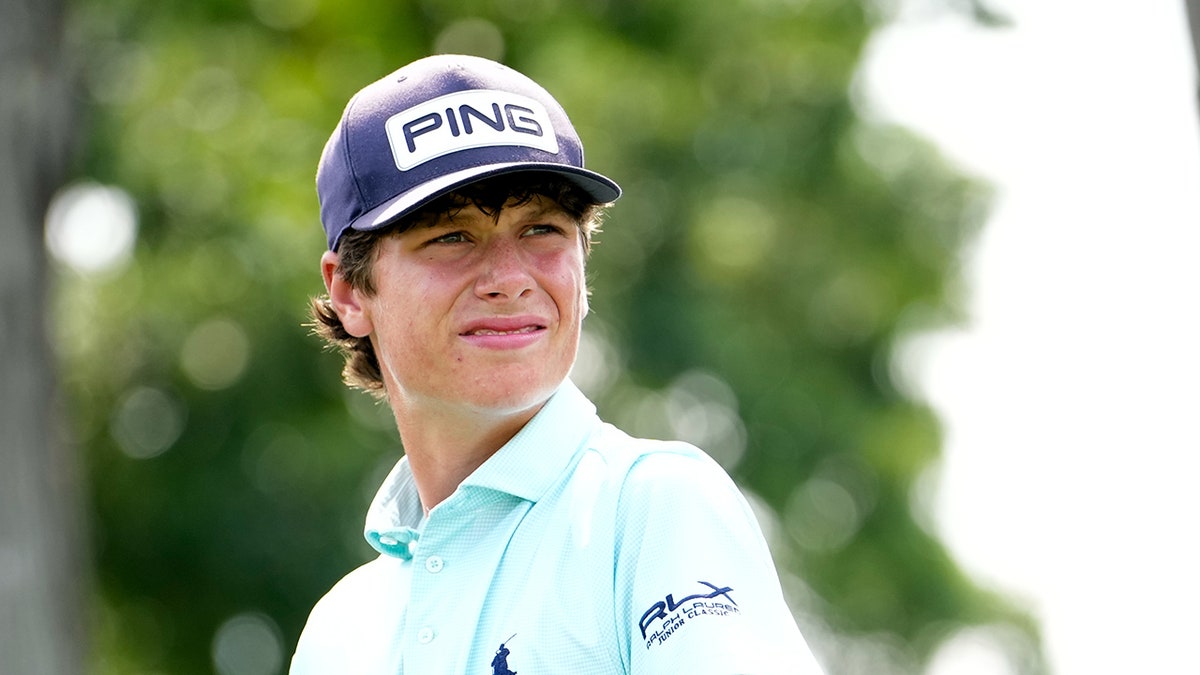 Mason Howell looks on golf course