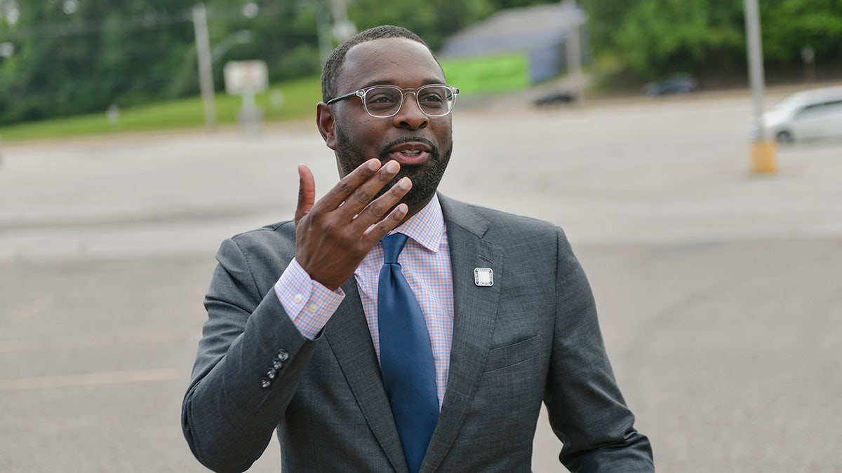 Memphis Mayor Paul Young posing for portrait in a gray suit and blue tie