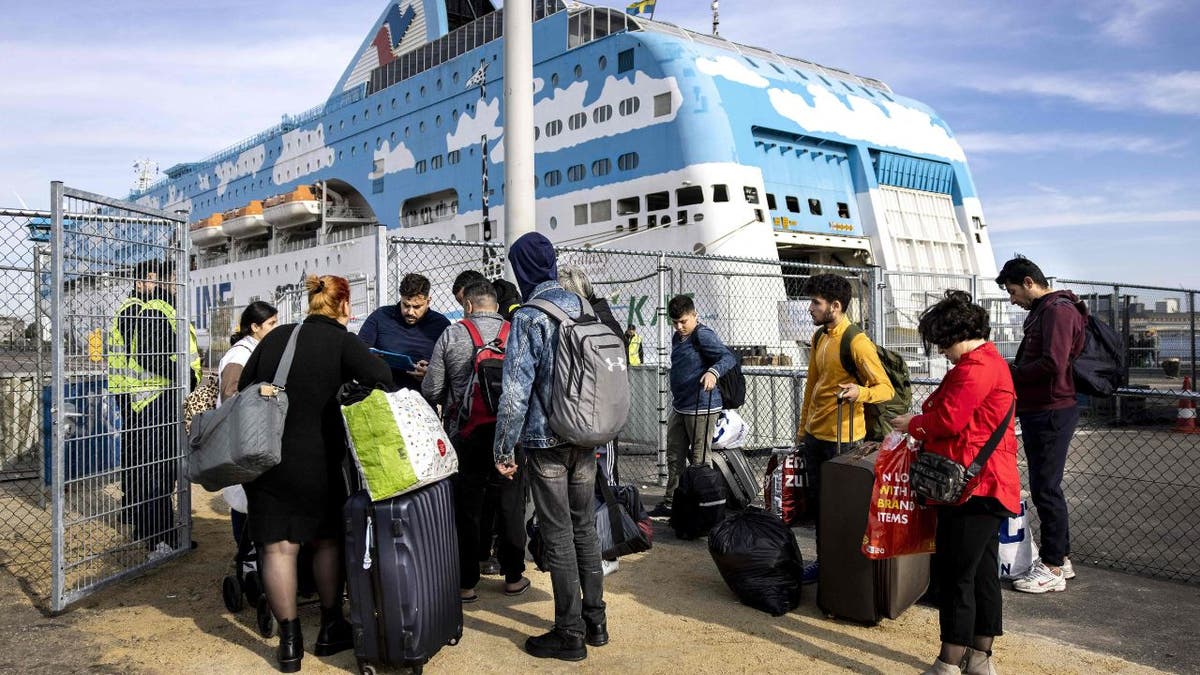 Asylum seekers arrive in the Westelijk Havengebied, to be accommodated on the cruise ship MS Galaxy