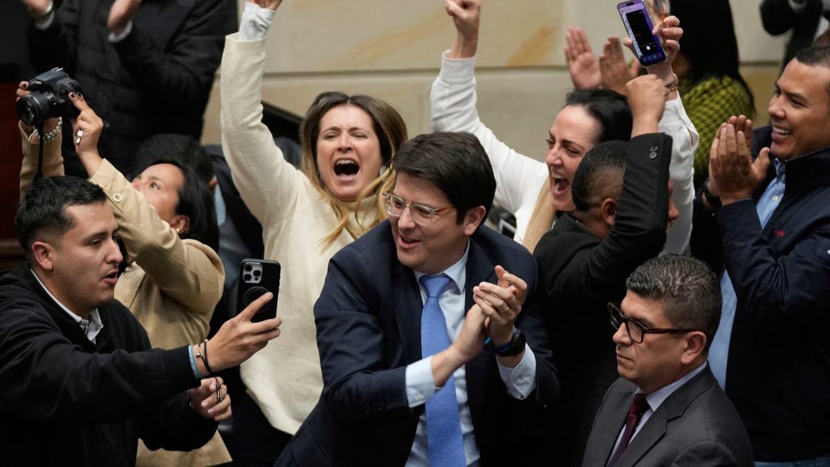 Miguel Uribe smiling with a crowd