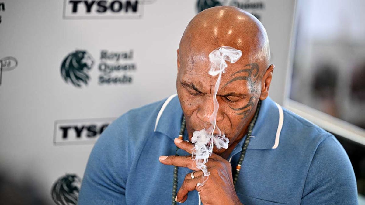 Mike Tyson smokes