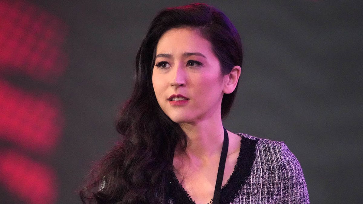 Mina Kimes looks on