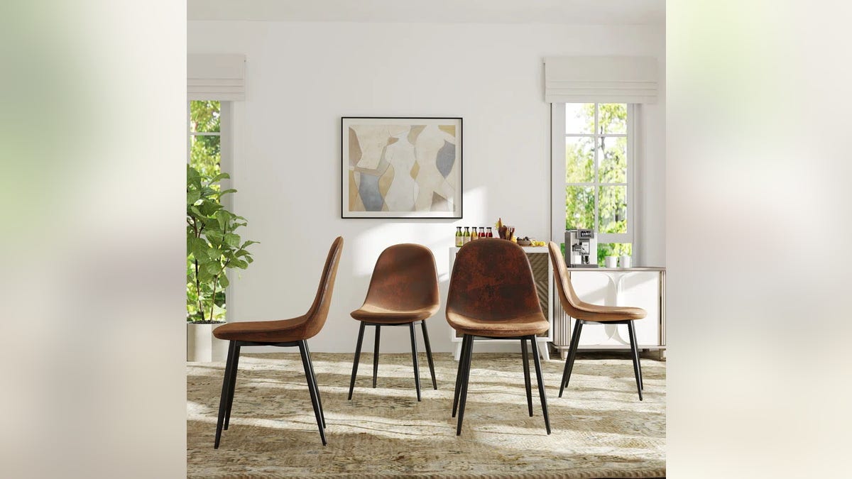 The Minehead Upholstered Side Dining Chair comes in a set of four.