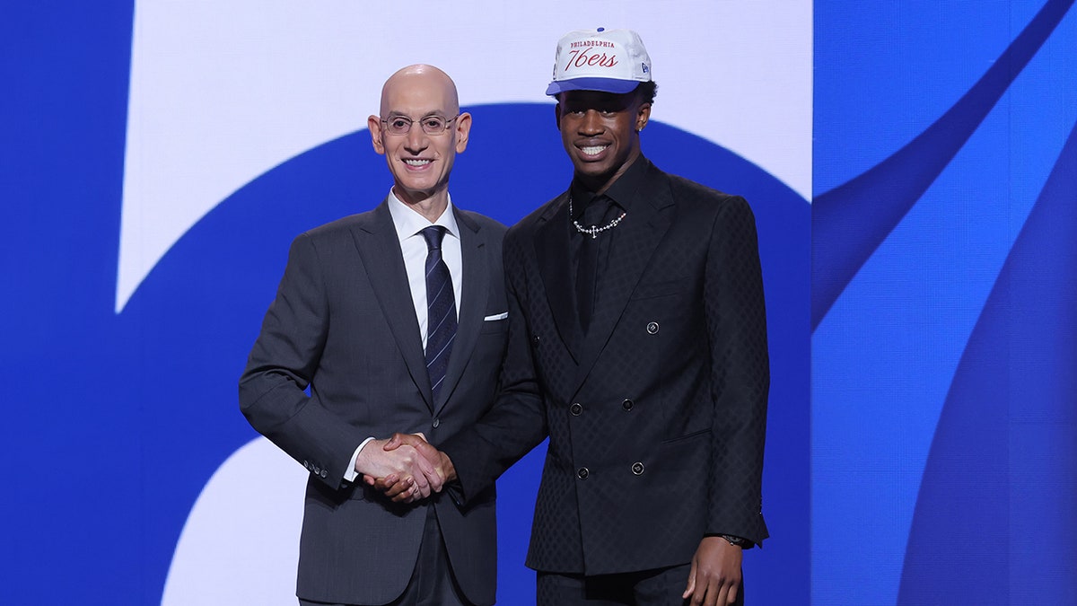 VJ Edgecombe stands with the NBA commissioner